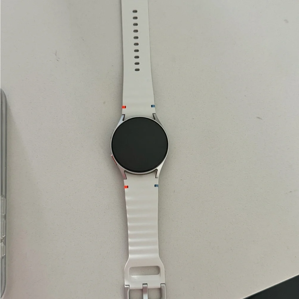 Samsung Smartwatch with White Strap and Black Face